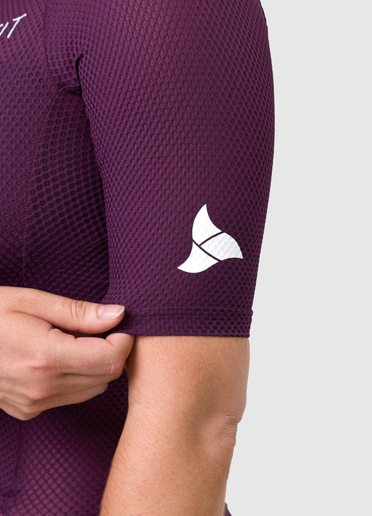 TRI-FIT logo printed on sleeve of VANGUARD tri-suit in plum, showing laser-cut finish