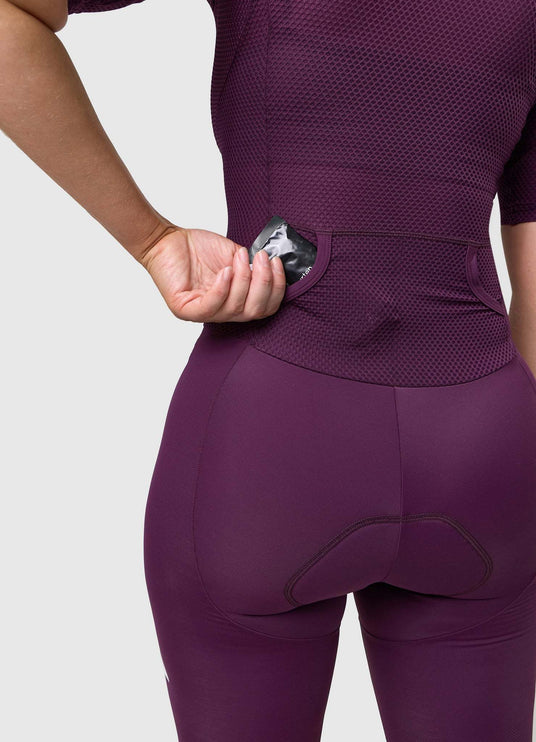 Close-up of rear pocket opening and internal stitching on VANGUARD tri-suit in plum