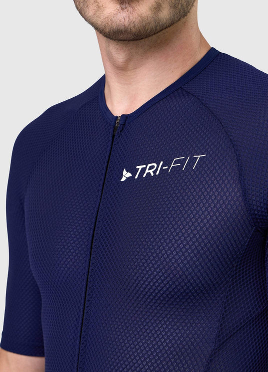 Close-up of TRI-FIT logo printed on chest of men’s VANGUARD tri-suit in navy, with breathable textured mesh fabric