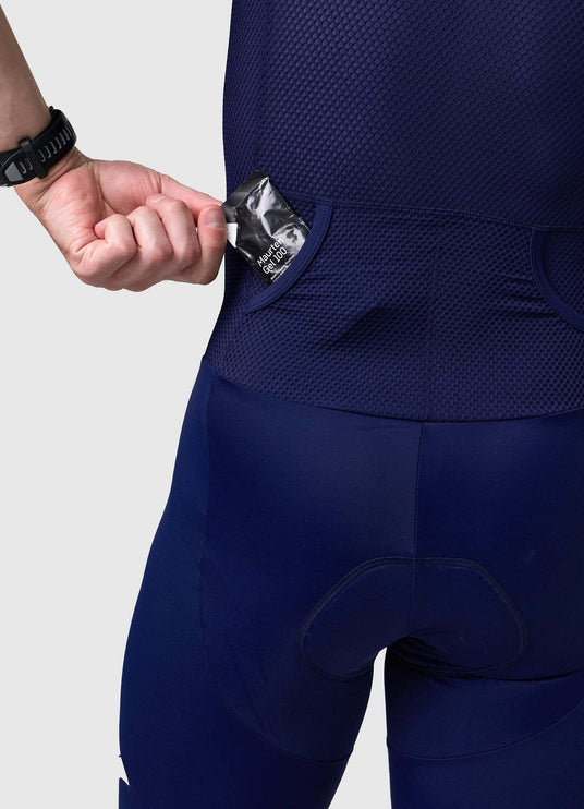 Detail of rear pocket entrance on men’s VANGUARD tri-suit in navy, showing reinforced mesh finish