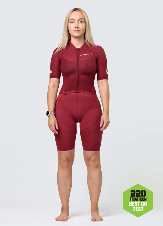 Front view of TRI-FIT VANGUARD tri-suit for women in wine red, featuring breathable upper and race-fit design/ 220 Triathlon Best on Test.